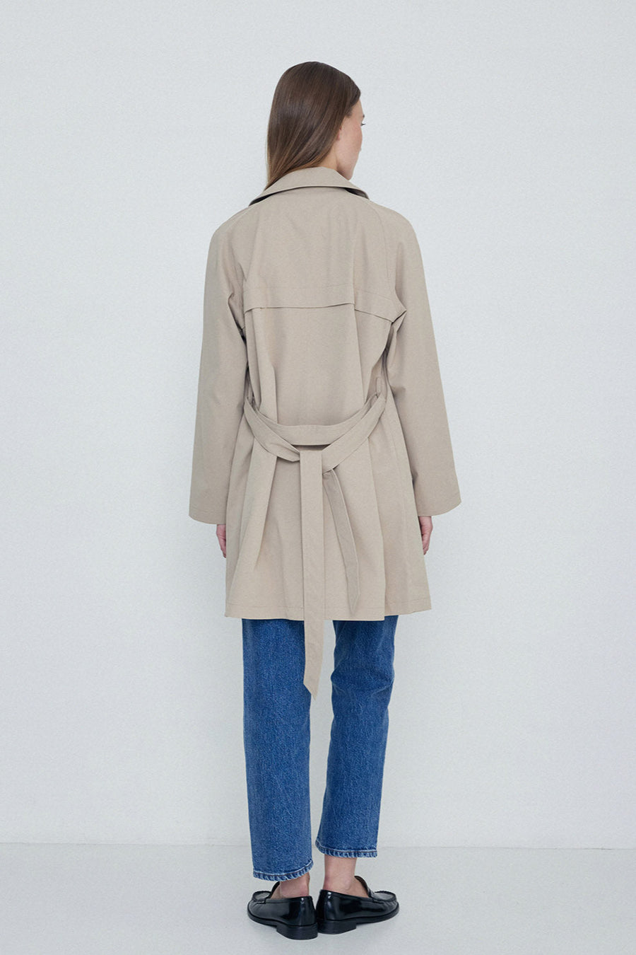 Sand midi length double breasted trench with wide belt. 