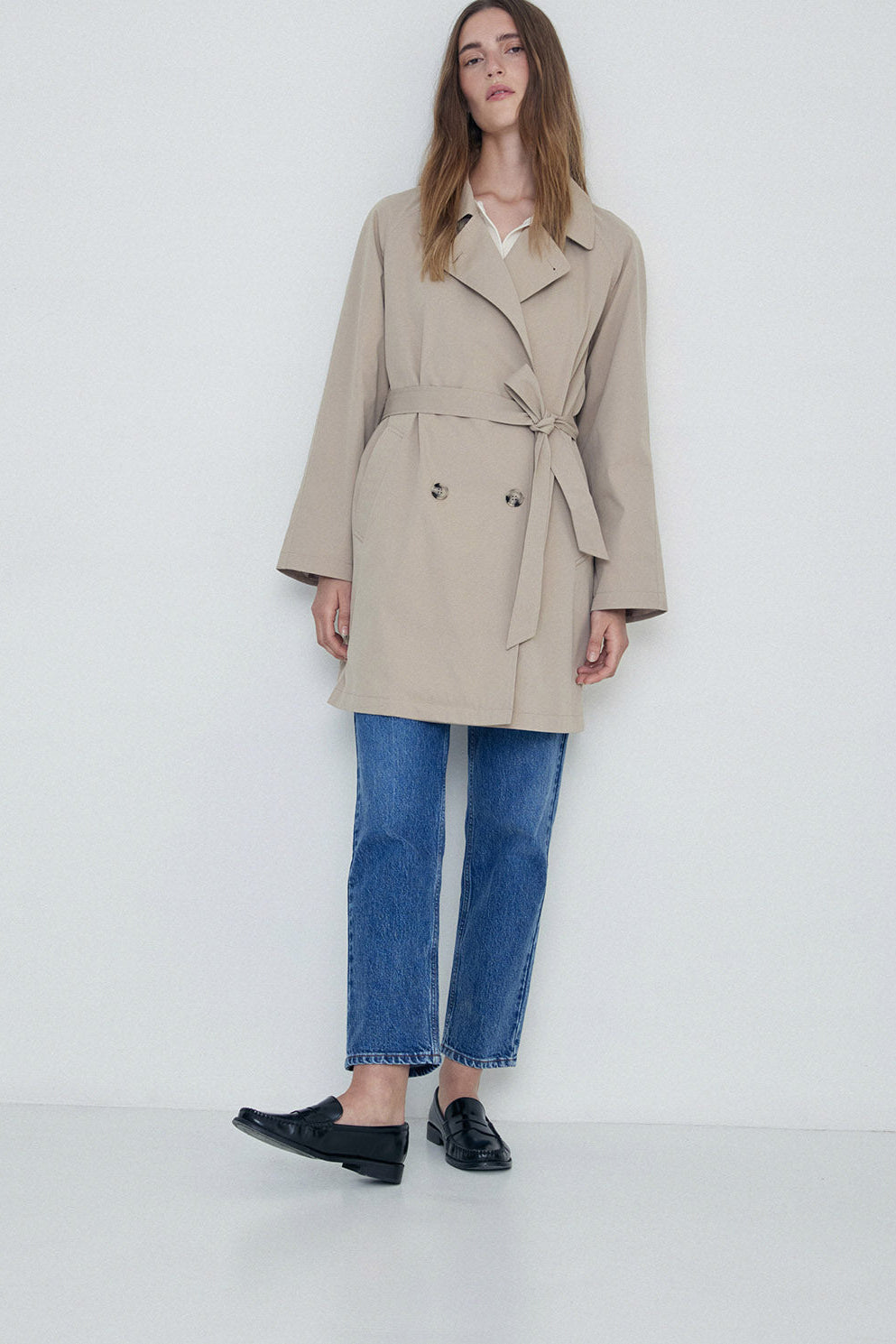 Sand midi length double breasted trench with wide belt. 