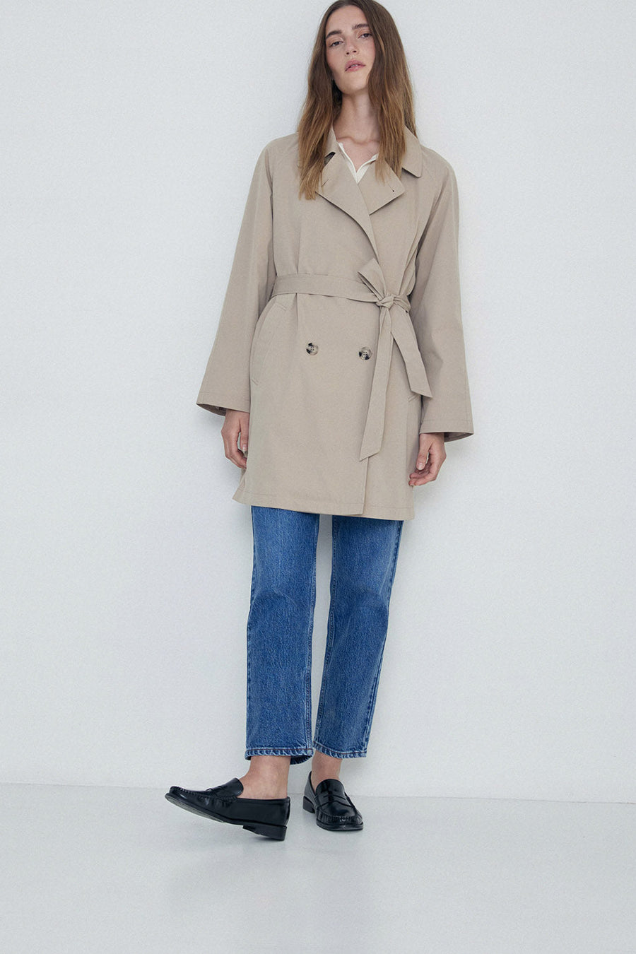 Sand midi length double breasted trench with wide belt. 