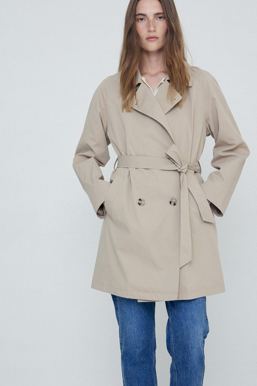 Sand midi length double breasted trench with wide belt. 