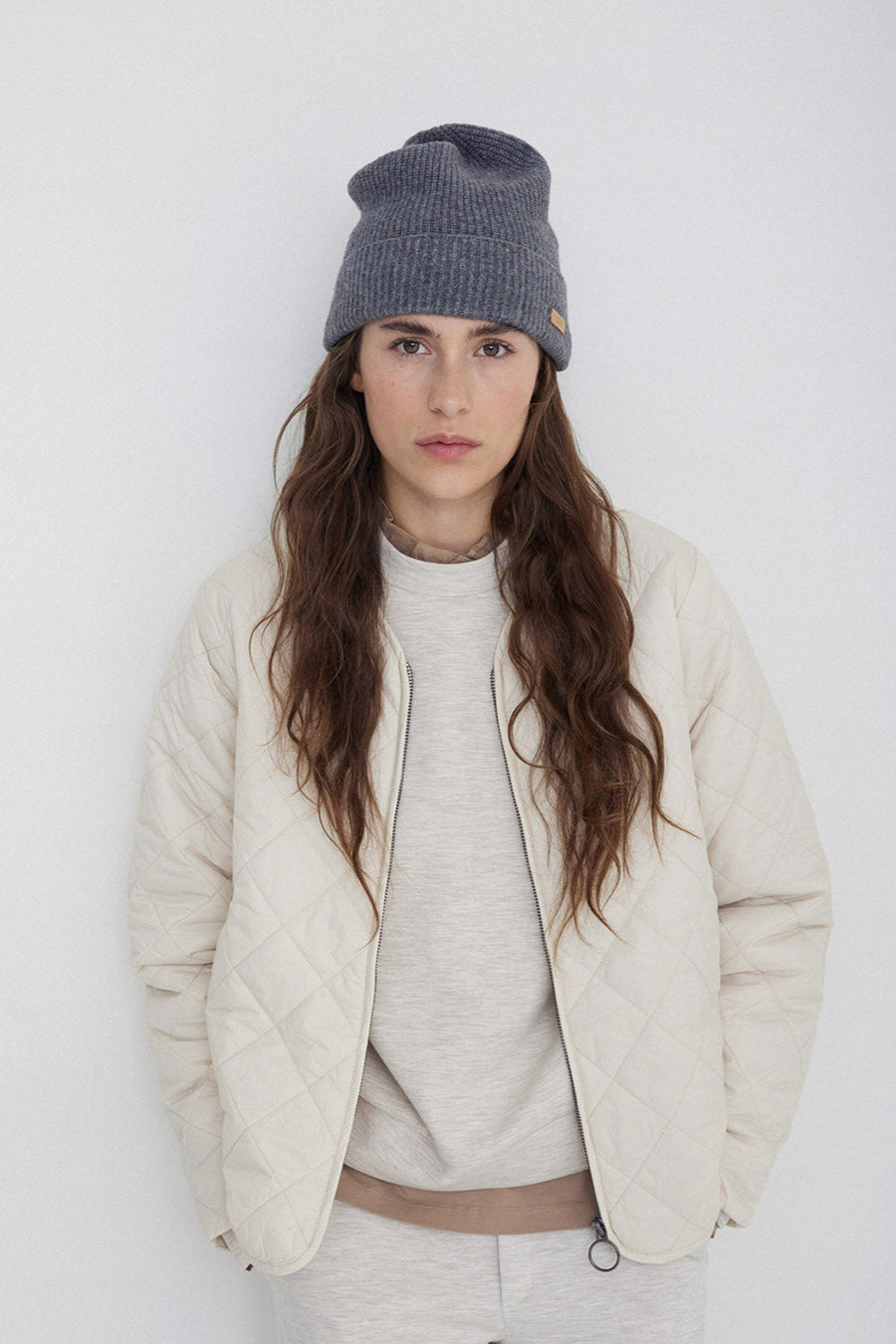 Long sleeve quilted jacket with front zip in natural colour way. 