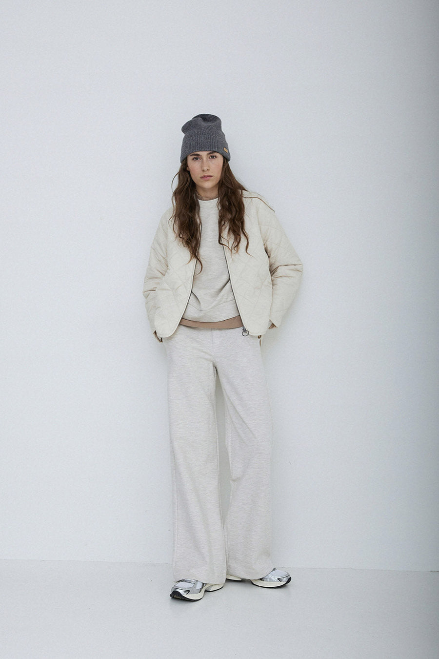 Long sleeve quilted jacket with front zip in natural colour way. 