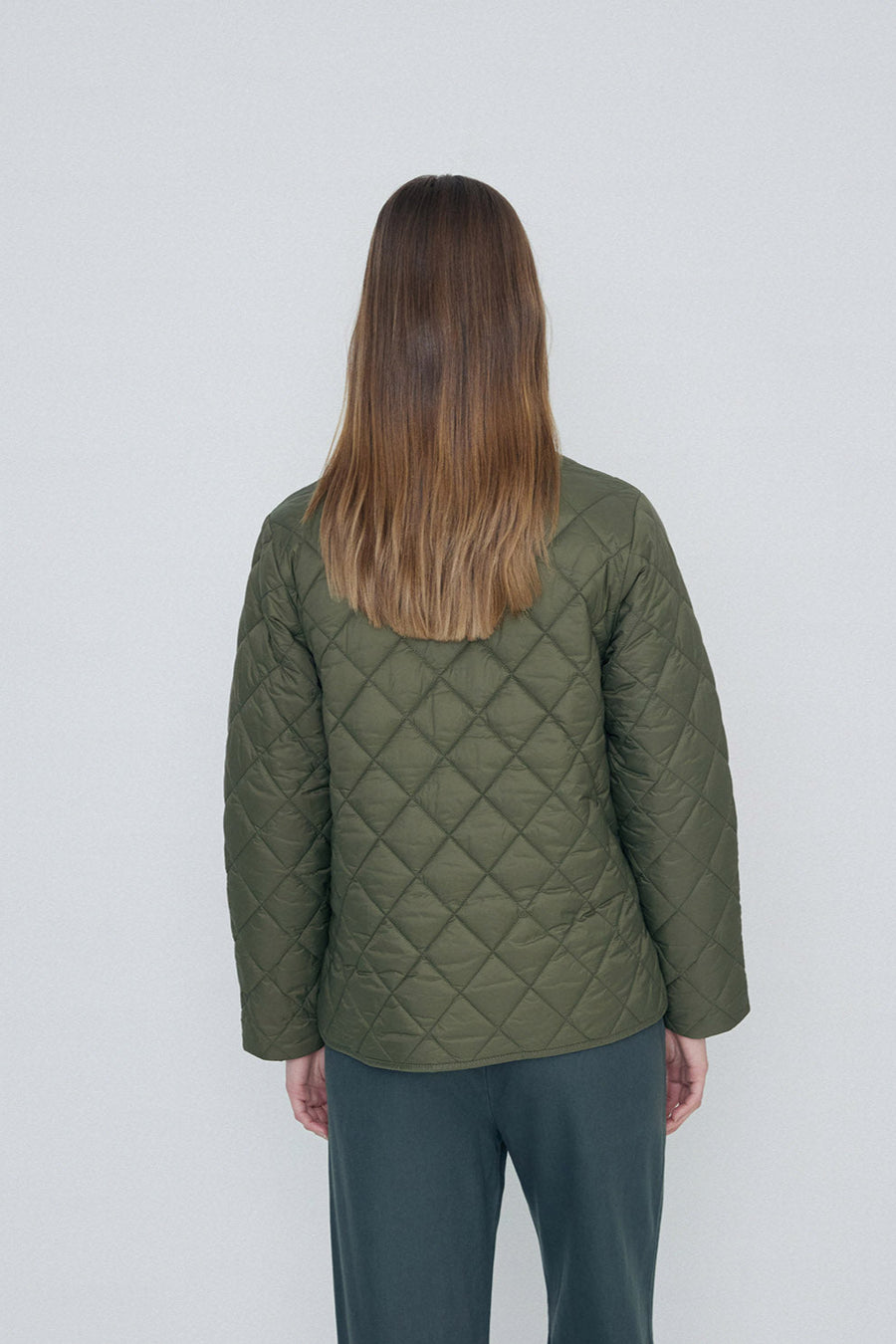 Khaki quilted long sleeve jacket with front zip.
