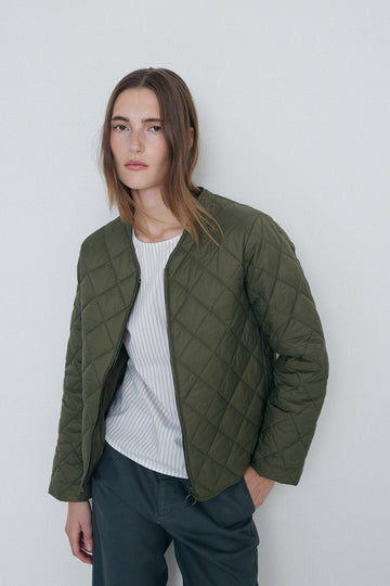 Khaki quilted long sleeve jacket with front zip.