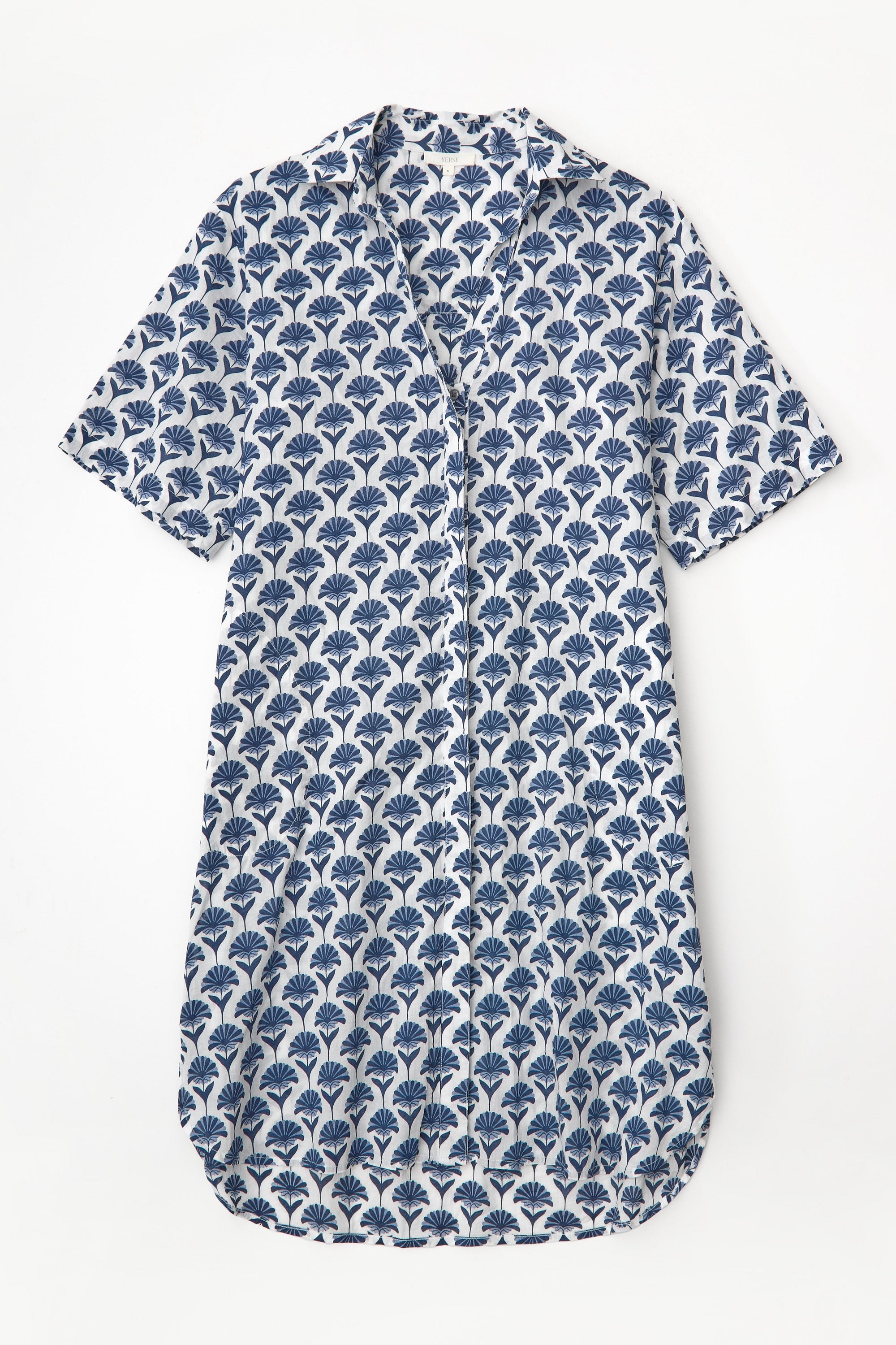 Blue and white patterned shirt dress with short sleeves  on a light grey background