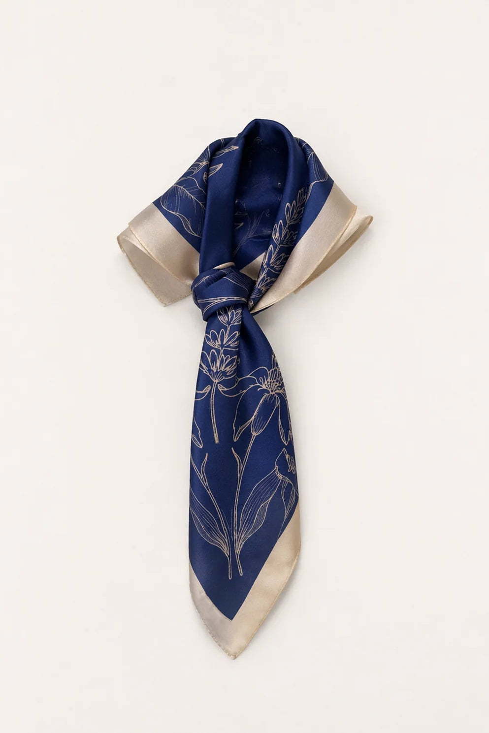Navy blue scarf with floral pattern on a white background