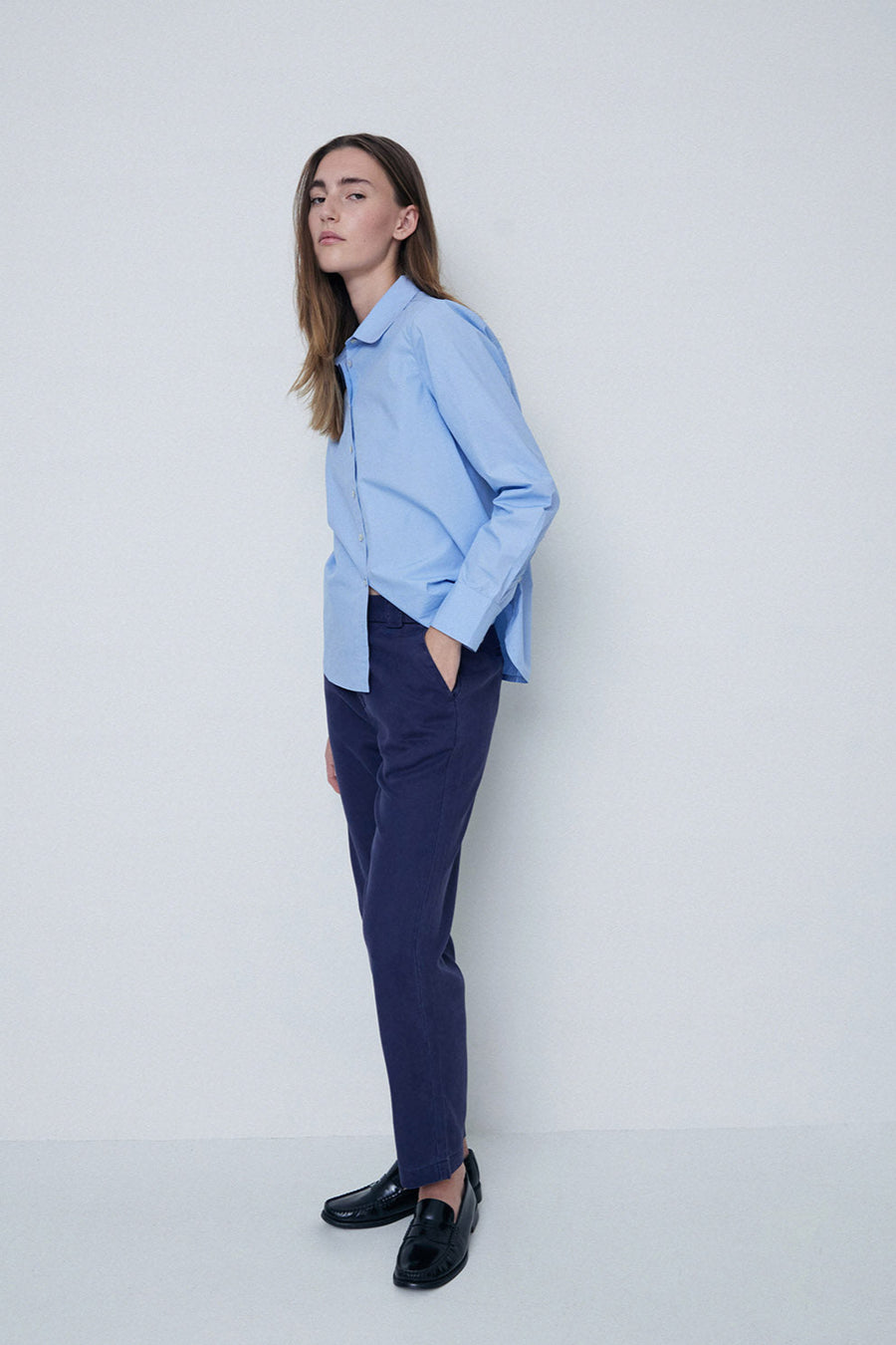 Navy straight leg trouser with elastic back and button and zip closure. 