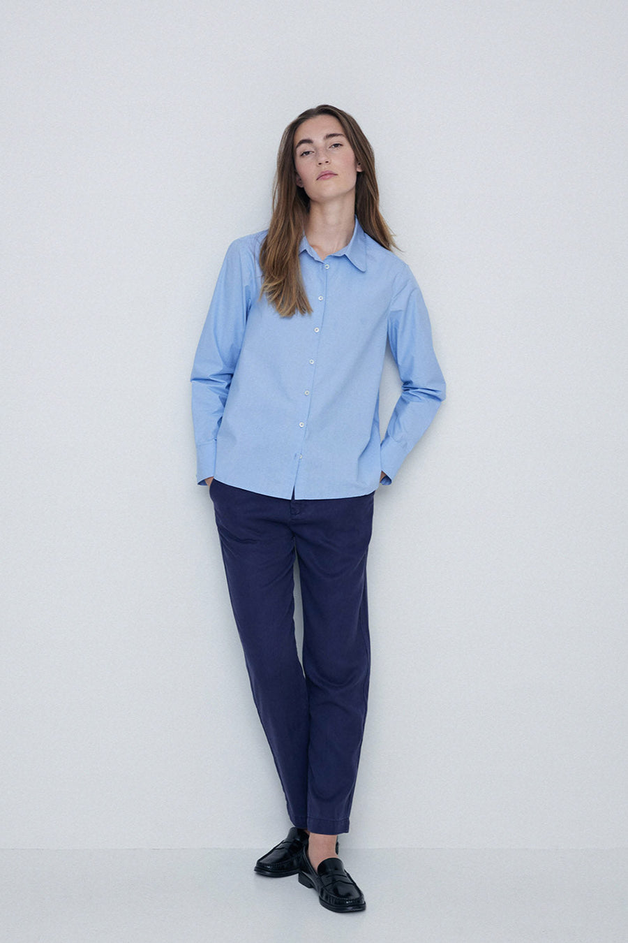 Navy straight leg trouser with elastic back and button and zip closure. 