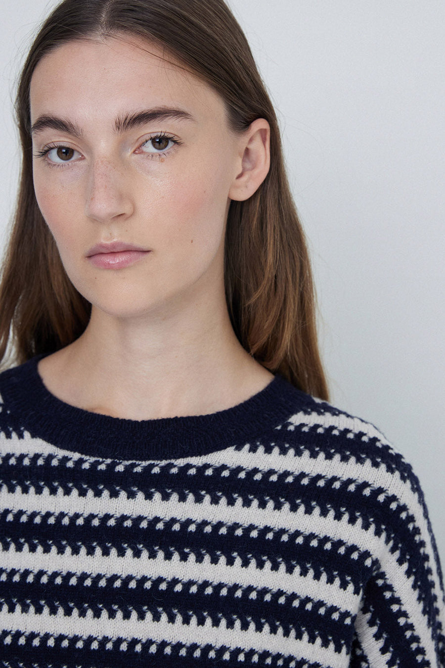 Navy and Ecru striped round neck wool sweater. 
