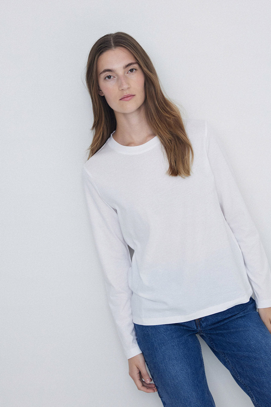 Round neck long sleeve tee shirt in white. 