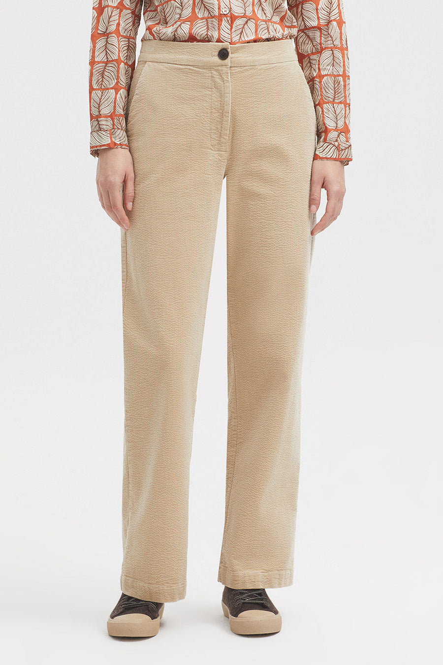 Straight leg bubble cord trouser in dark ecru with tan button. 