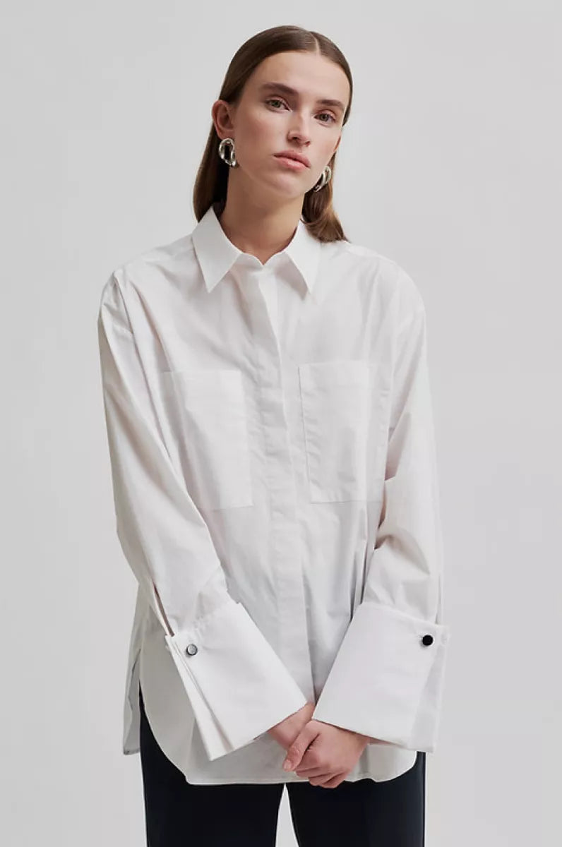 White long sleeve shirt with cuffs. 