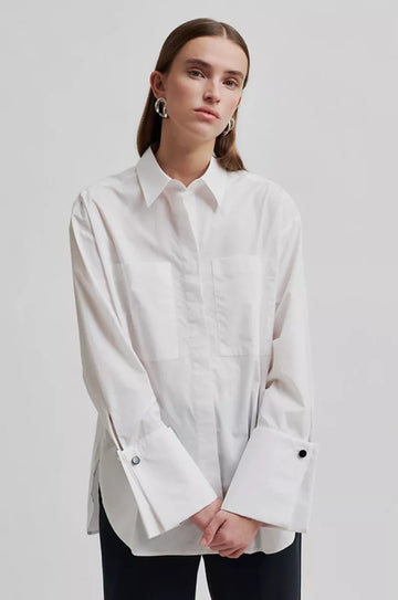 White long sleeve shirt with cuffs. 