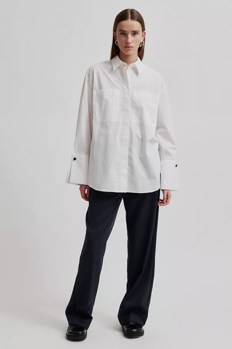 White long sleeve shirt with cuffs. 