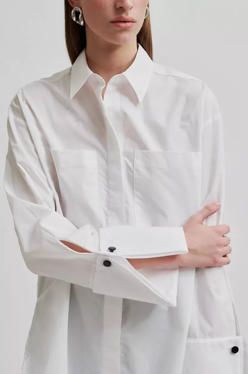 White long sleeve shirt with cuffs. 