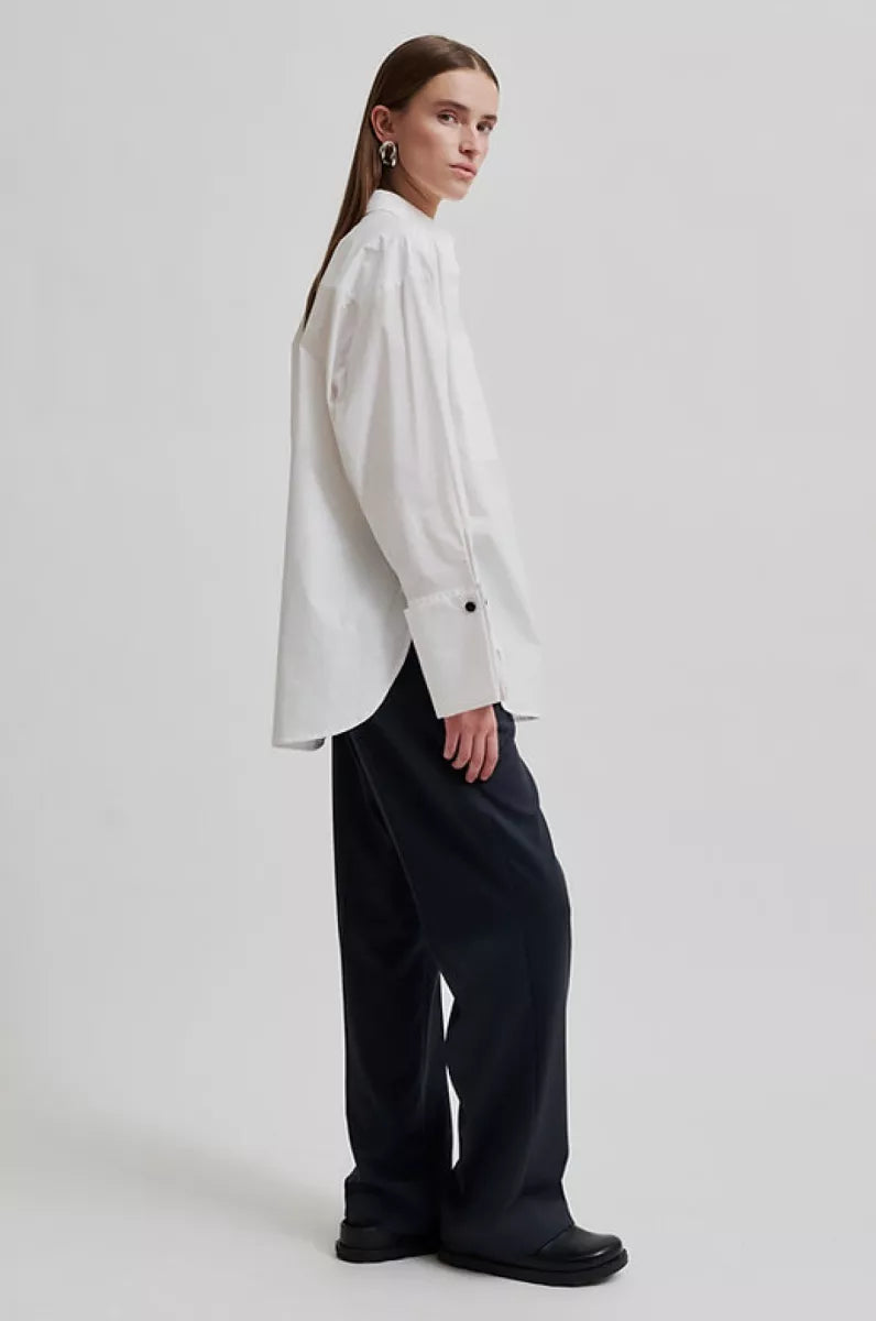 White long sleeve shirt with cuffs. 