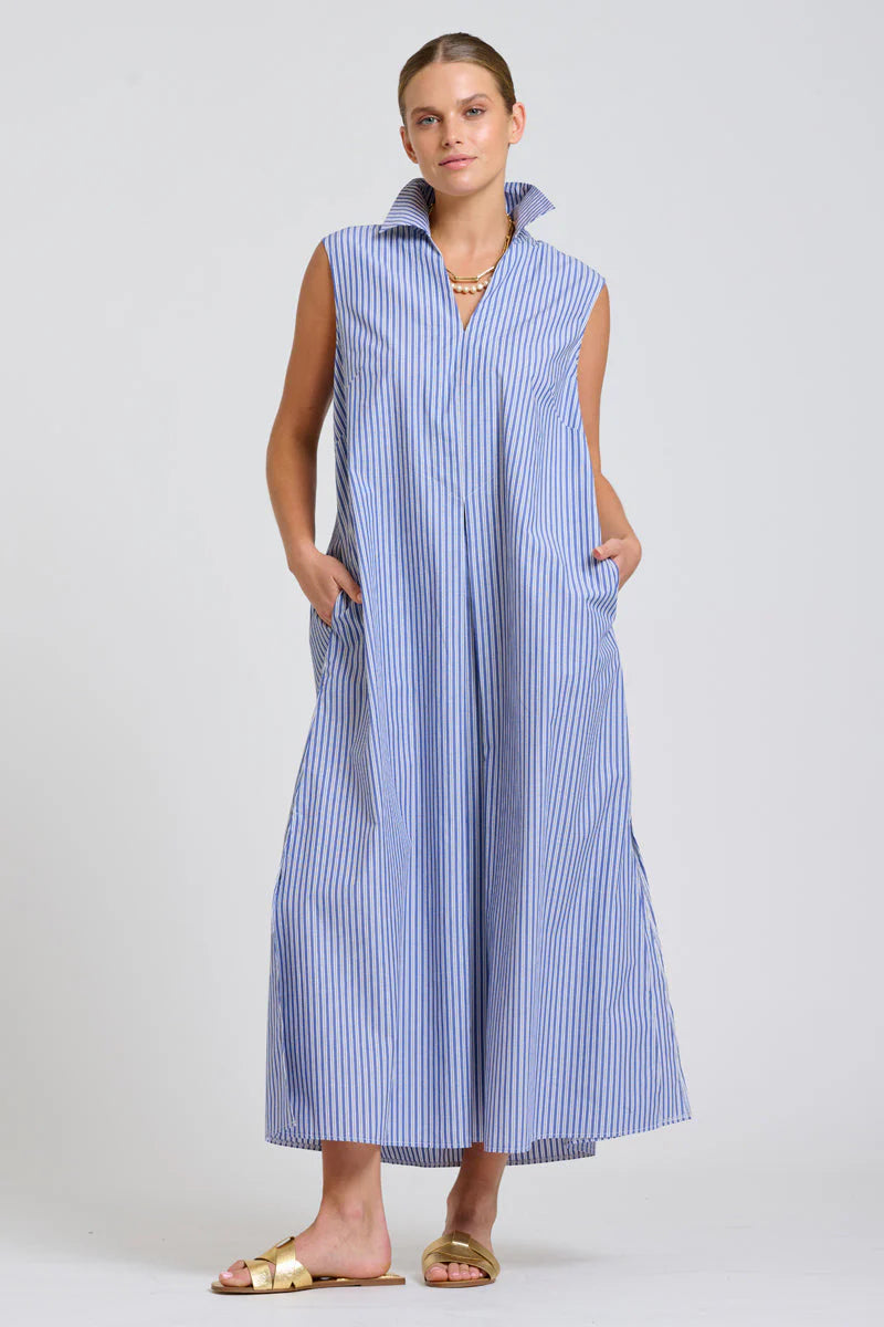 Women wearing a sleeveless navy and light blue stripe shiest dress on a white back ground. 