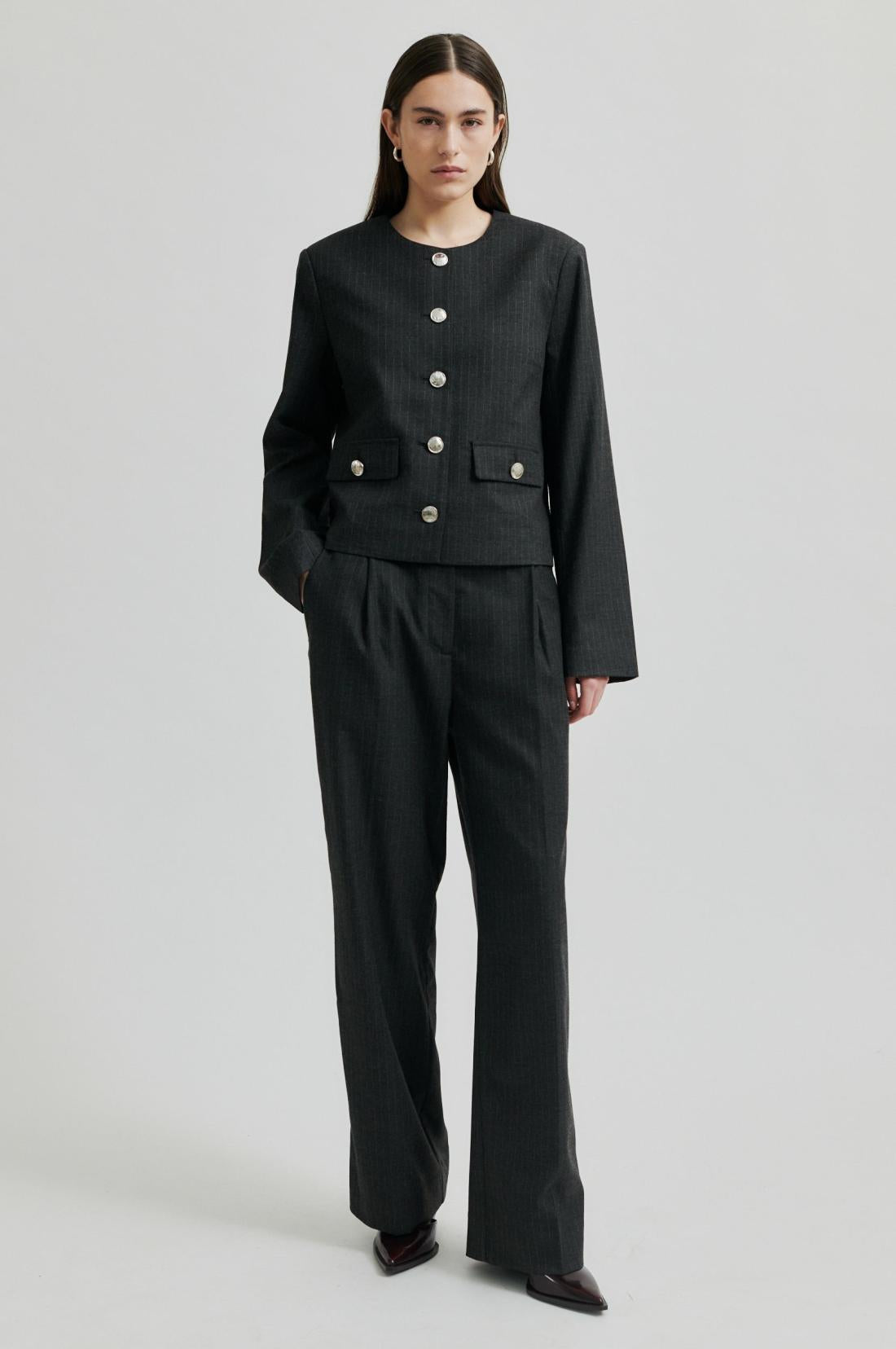 Mid Rise Straight leg pin stripe suit pant in dark grey melange.  Front pleats and side pockets. 